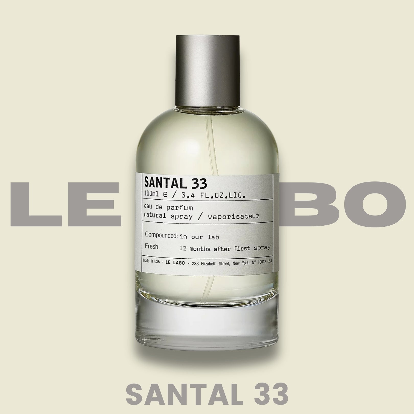 Le Labo Santal 33 perfume cologne bottle, front view on cream background